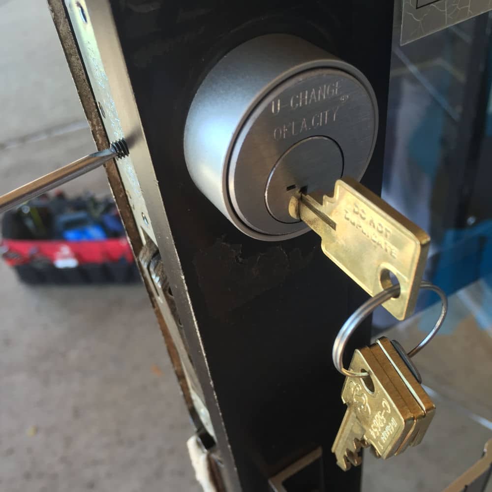 key in a door during a new lock installation