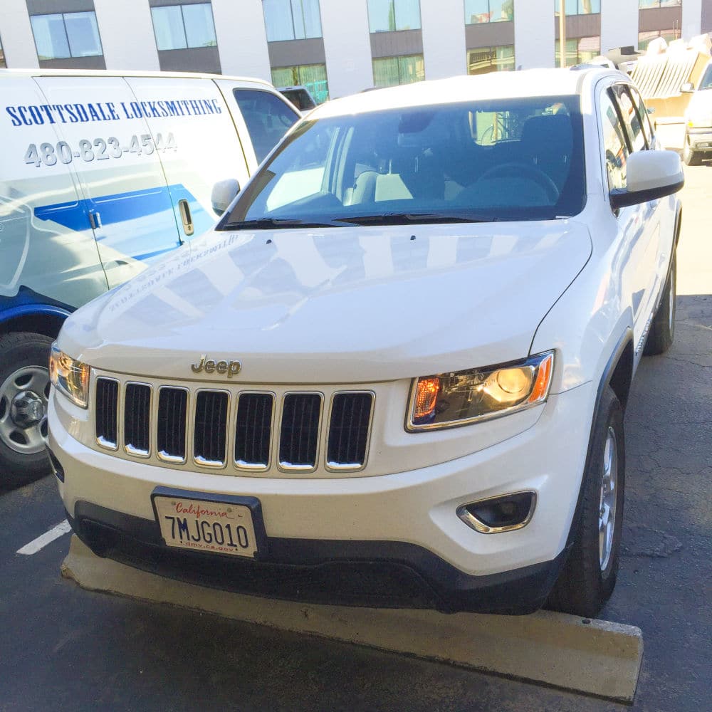 Scottsdale Locksmithing van by a customer in need of a car locksmith.